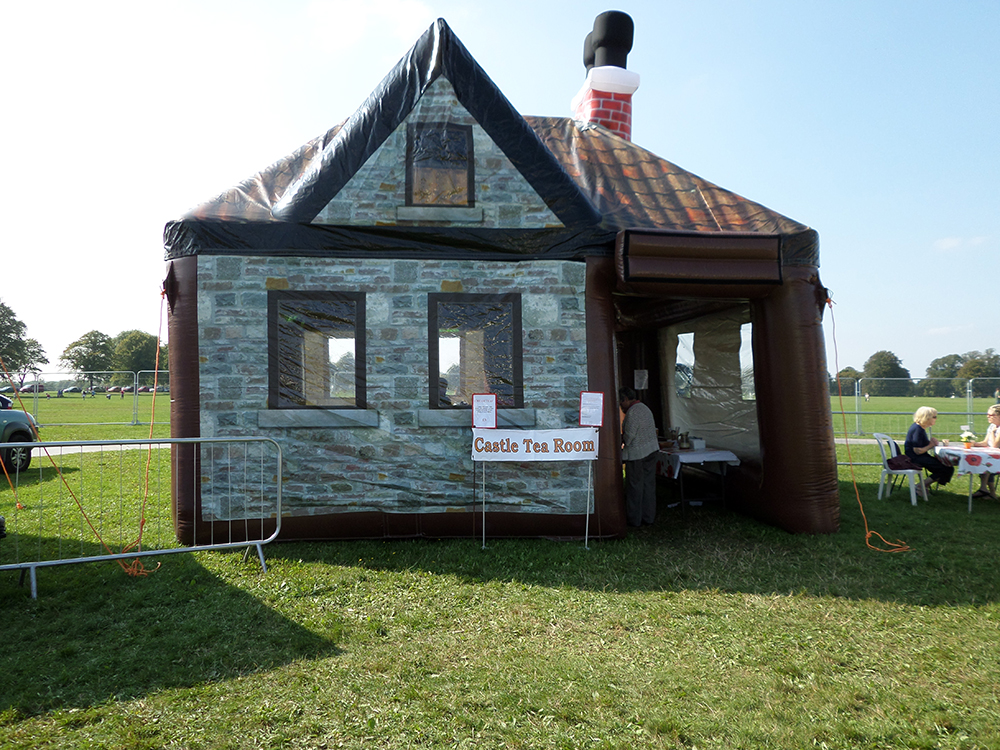 One of our newest additions, the pop-up inflatable Tea Room has previously been used as a cosy pub or an intimate banquet area. It can comfortably seat 15+ people, more standing. Incredibly quaint and unusual, ideal for small gatherings and parties, or even large open events. Ideal to run alongside any hot food unit, selling cream teas, homemade cakes, light bites and hot/cold drinks.Assorted packages and prices available. If you're looking for a weekend hire, prices can be negotiated.