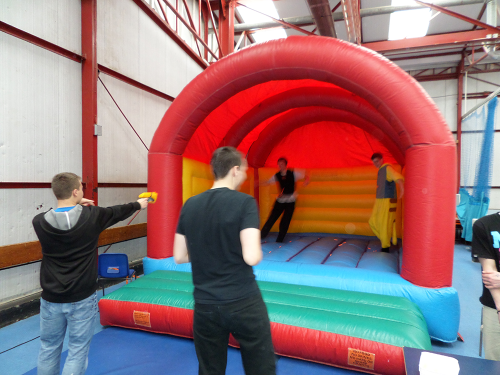 Introducing the Nerf Castle! This inflatable can be both used as a standard bouncy castle, or as a super fun bouncy mini game! Load up your Nerf Guns with darts and attack your friends and family for hours of active battle! This full size bouncy castle can come complete with Nerf Pistols, Darts and Nerf Vests for an additional £20. Suitable for children up to 14 years.
